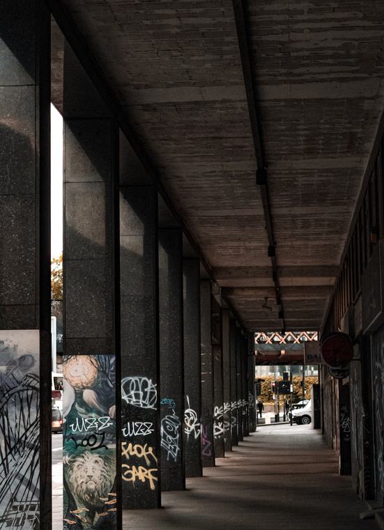 Concrete colonnade, graffiti all the way down