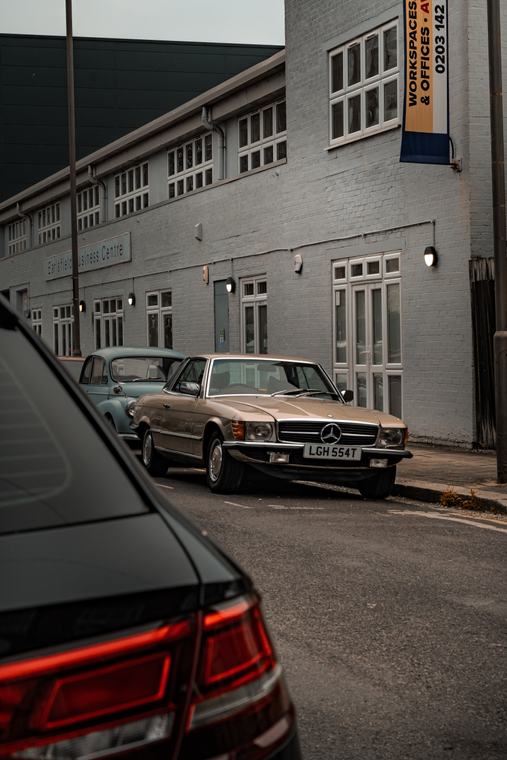 Parked up, white building behind