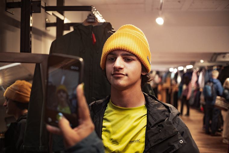 Yellow beanie, caught in a shop mirror