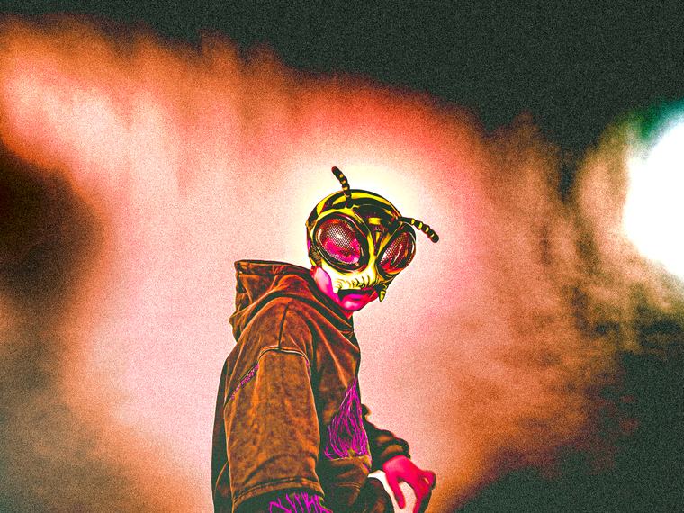 The mask, side on, colour pushed until it bleeds