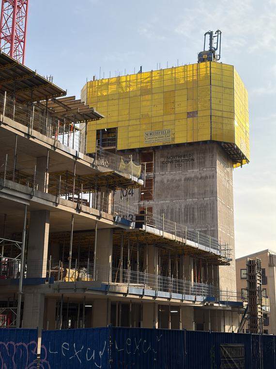 Yellow wrap on a building coming down