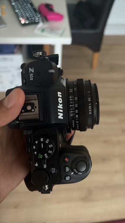 The camera, in hand