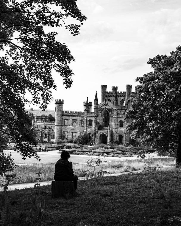 The castle, and somebody sitting in front of it