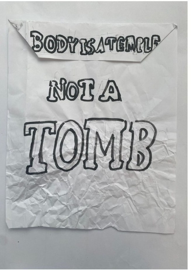Hand lettering — 'body is a temple, not a tomb', the line that set the format